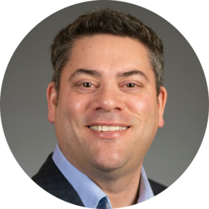 A headshot of Brett Powers