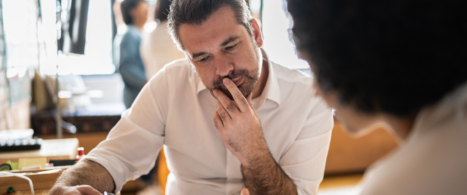 Man looking down at information